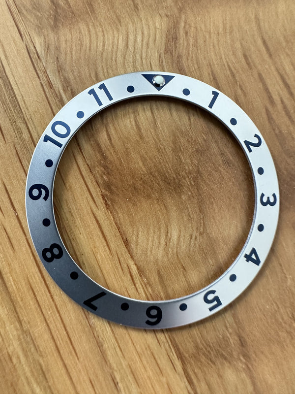 GMT Silver Bezel Insert Measuring 39mm X 30.7mm fits various brands including the MWC 300m Divers Watches and GMT models
